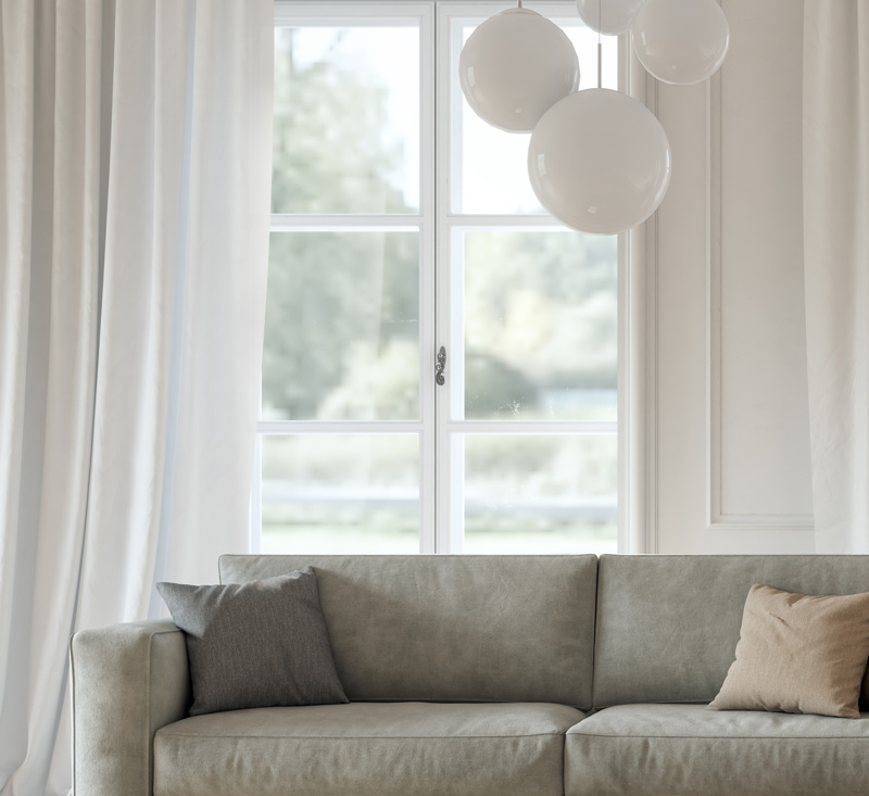 Modern living room with sofa - Residential Glass Repair, Replacement & Tint Services